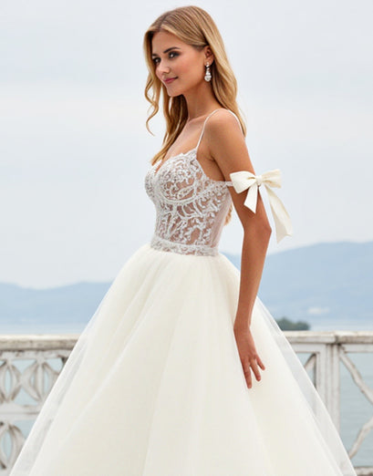 Ivory Organza Sweep Train Spaghetti Straps Ball Gown Wedding Dress with Bow