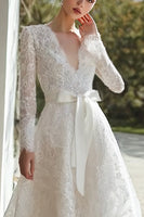 Load image into Gallery viewer, Ivory Lace A Line V-Neck Sweep Train Long Sleeves Wedding Dress with Bow